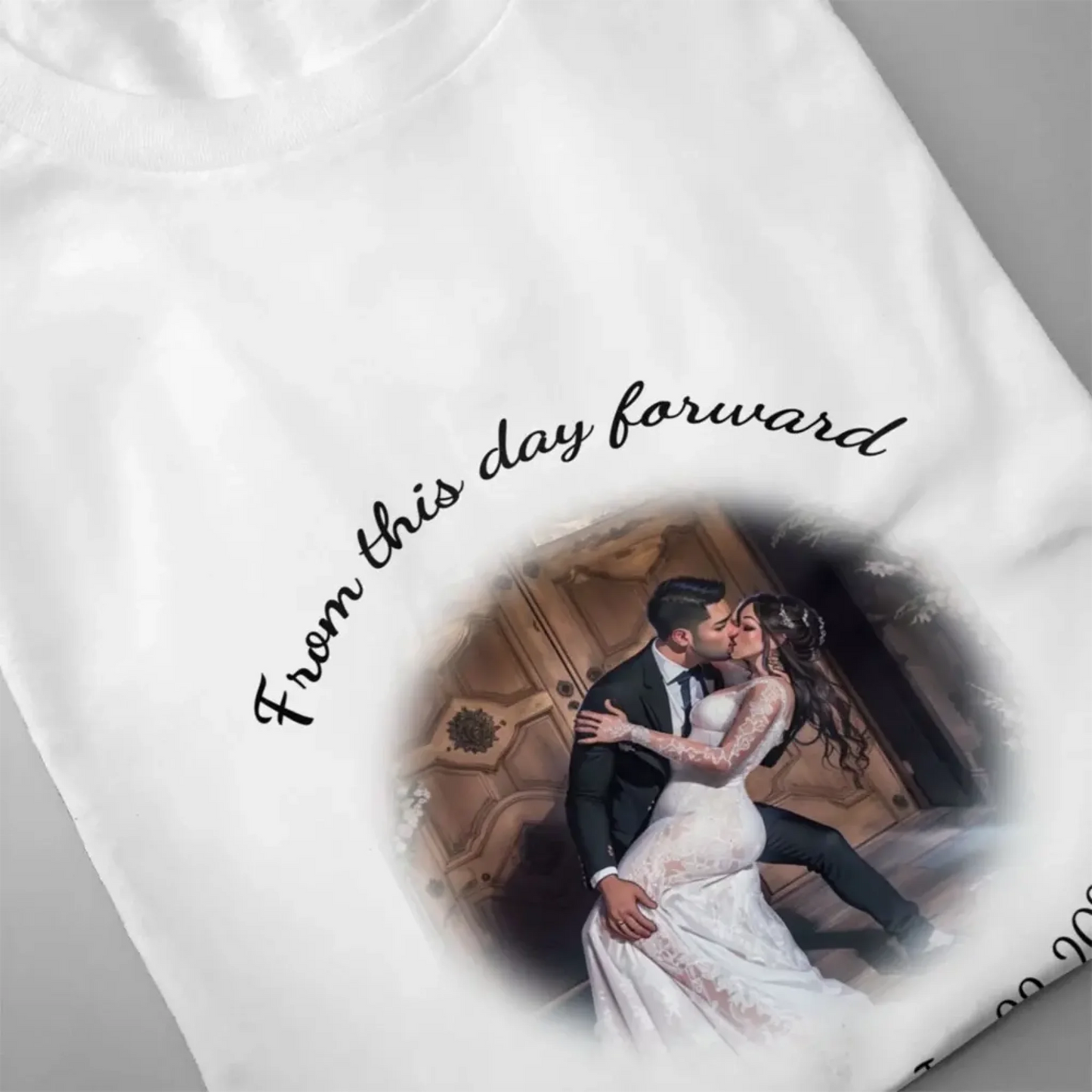 Close-up of a custom wedding T-shirt showing detailed cartoon-style couple illustration print with circular personalized text, highlighting high-quality design and print clarity.