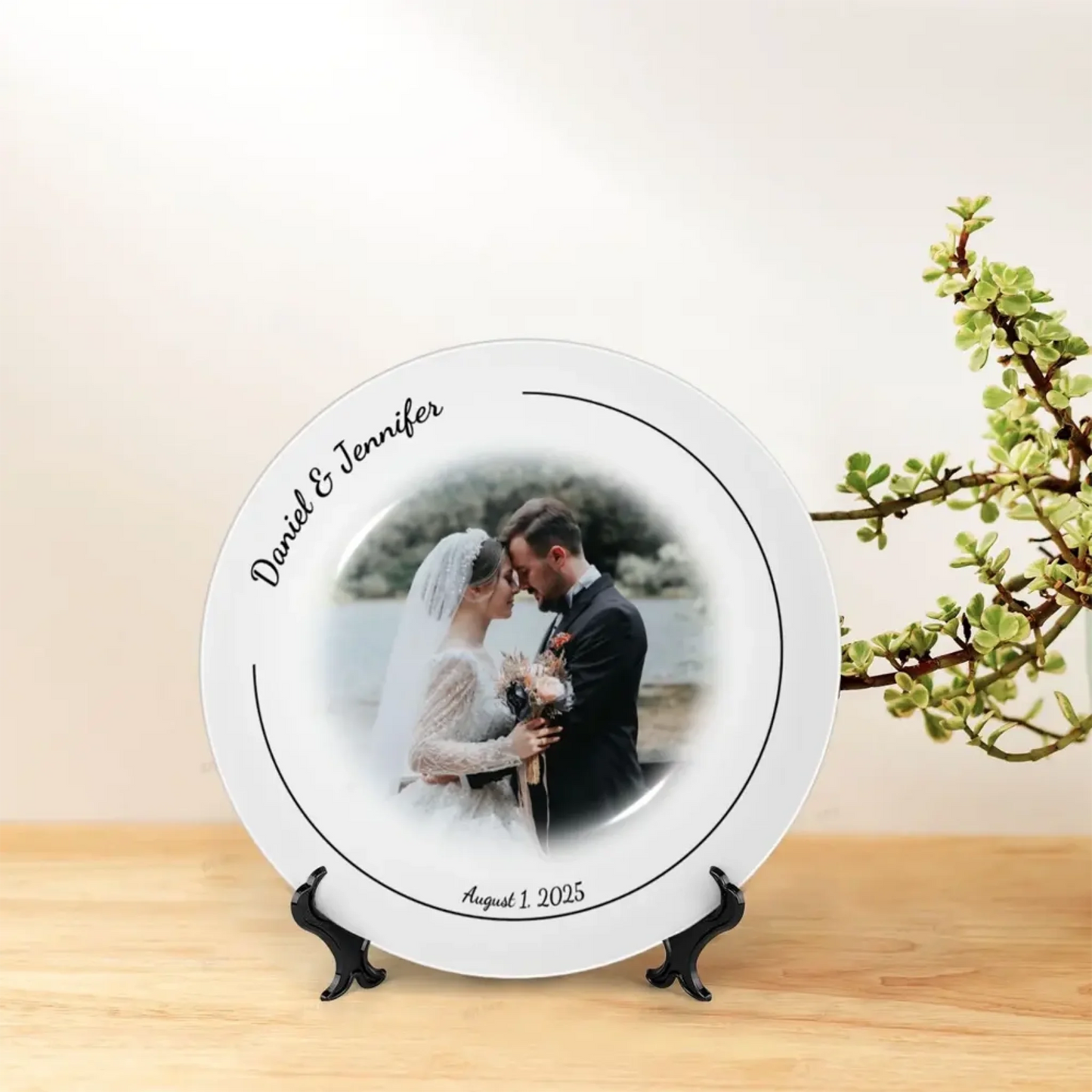 Bone china wedding decorative plate displayed on table with stand, customizable with photo, names, and date. Elegant personalized wedding or anniversary gift, perfect for home decoration or bridal table display.