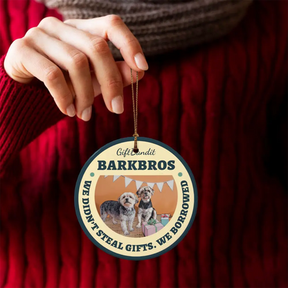 Personalized ceramic ornament held in hand showing the photo details and smooth ceramic finish